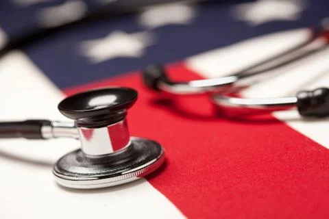 Stethoscope on American Flag with Selective Focus. Stock Photos