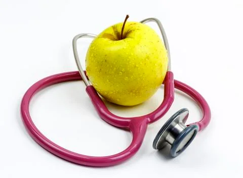 Stethoscope and an apple Fotos de archivo