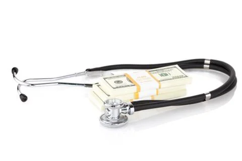 Stethoscope and dollars Stock Photos
