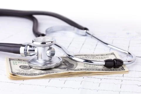 Stethoscope and dollars Stock Photos