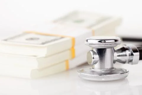 Stethoscope and dollars Stock Photos