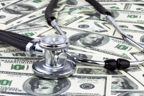 Stethoscope and dollars Stock Photos