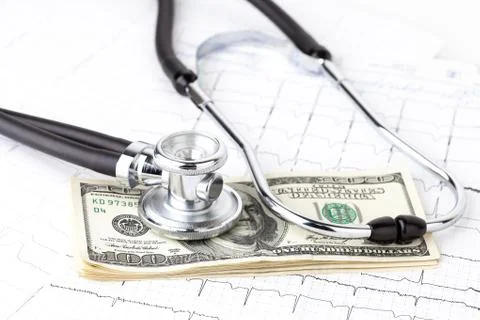 Stethoscope and dollars Stock Photos
