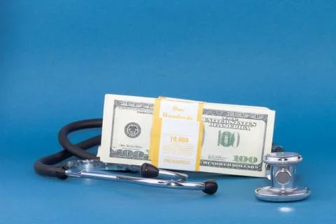 Stethoscope and dollars Stock Photos