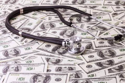 Stethoscope and dollars Stock Photos