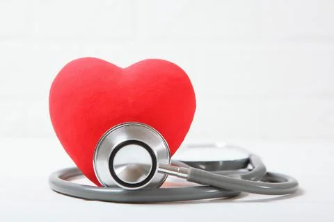 Stethoscope and heart on wooden background. Health, medicine Stock Photos