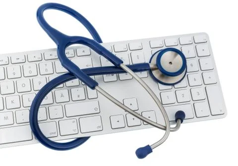 Stethoscope and keyboard of a computer 스톡 사진
