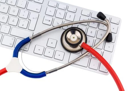 Stethoscope and keyboard of a computer 스톡 사진