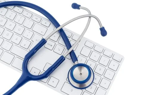 Stethoscope and keyboard of a computer Stock Photos