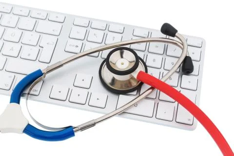 Stethoscope and keyboard of a computer Stock Photos
