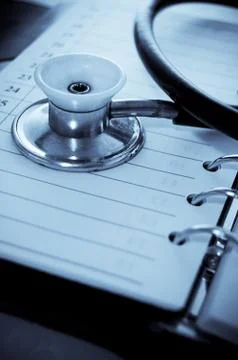 Stethoscope and notebooke Stock Photos