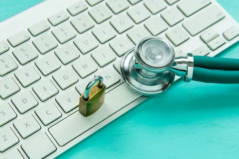 Stethoscope and padlock on a computer keyboard Foto stock