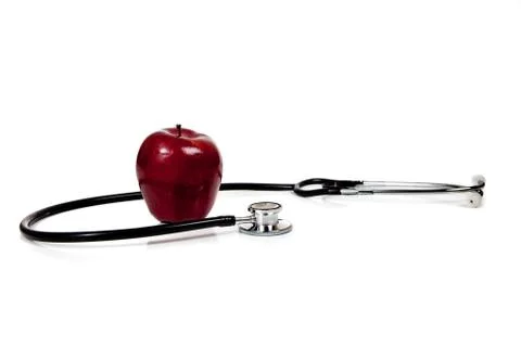 Stethoscope with apple on a white background Stock Photos