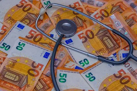 Stethoscope on banknotes Stock Photos