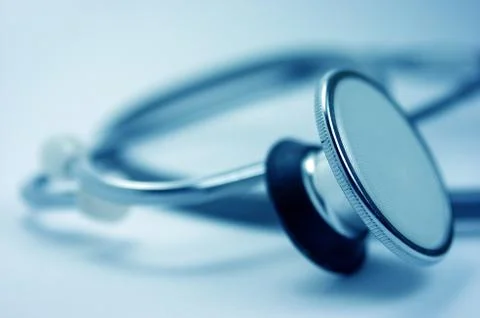 Stethoscope, blue background Stock Photos