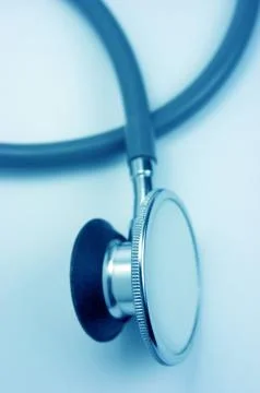 Stethoscope, blue background Stock Photos