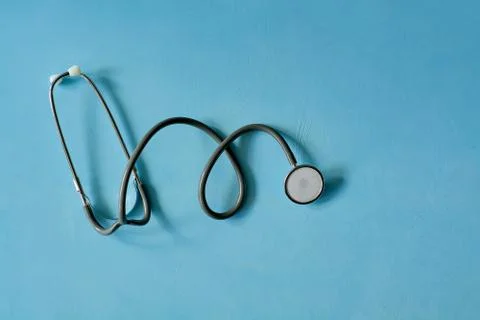 Stethoscope on blue background. Stock Photos