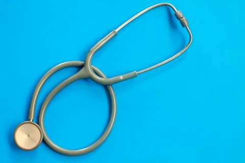 Stethoscope on a blue background with space for text. Stock Photos