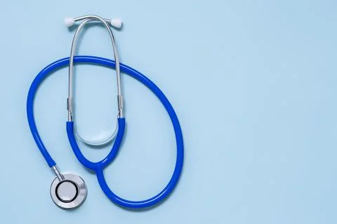 Stethoscope on blue background top view , Flat lay medical and Health care or Stock Photos