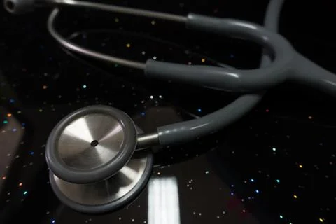 Stethoscope on blue, reflective background Foto stock