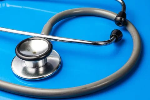 Stethoscope on blue surface Stock Photos