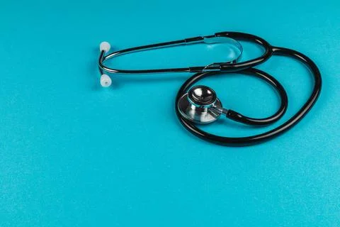 Stethoscope on bright blue background Stock Photos