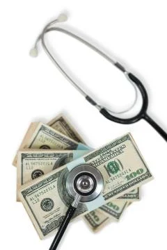 Stethoscope on bundle of currency note Foto stock