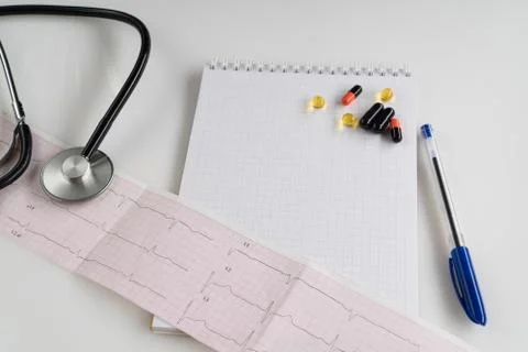 Stethoscope with cardiogram Stock Photos