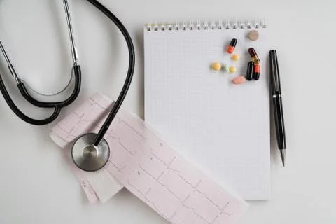 Stethoscope with cardiogram Stock Photos
