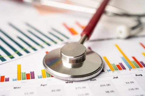 Stethoscope on charts and graphs spreadsheet paper, Finance, Account, Stati.. Stock Photos
