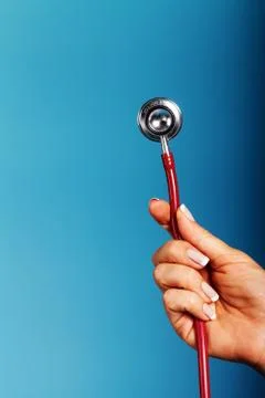 Stethoscope close-up in the doctor's hand Stock Photos