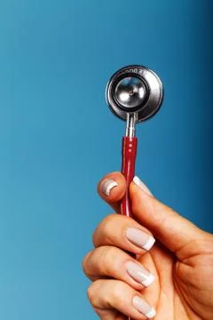 Stethoscope close-up in the doctor's hand Stock Photos