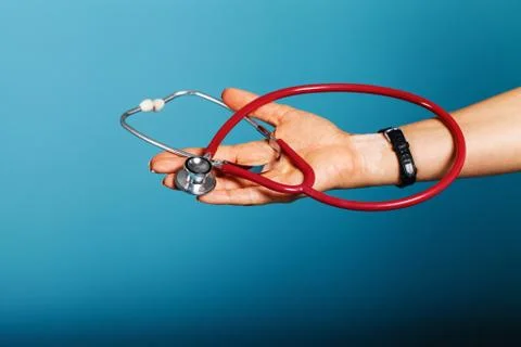 Stethoscope close-up in the doctor's hand Stock Photos