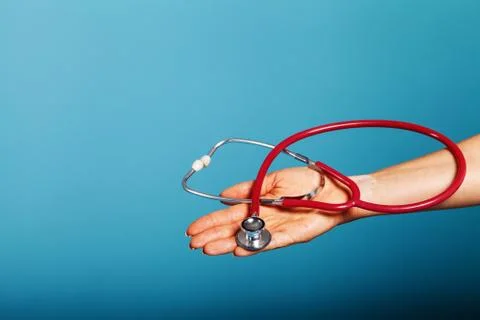 Stethoscope close-up in the doctor's hand Stock Photos