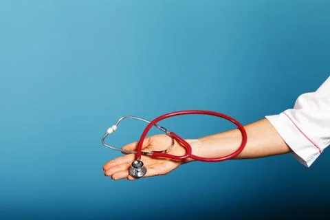 Stethoscope close-up in the doctor's hand Stock Photos