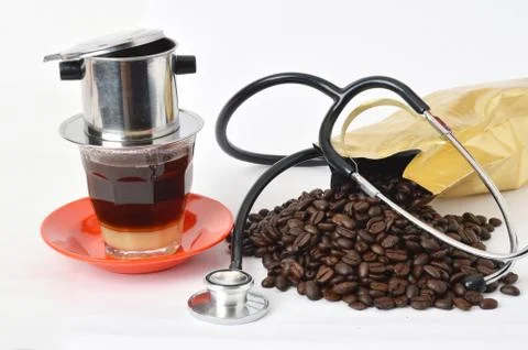Stethoscope with coffee beans Stock Photos