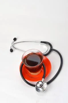 Stethoscope with coffee beans Stock Photos