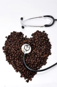 Stethoscope with coffee beans Stock Photos