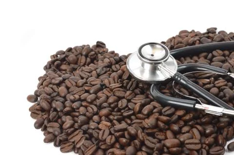 Stethoscope with coffee beans Stock Photos