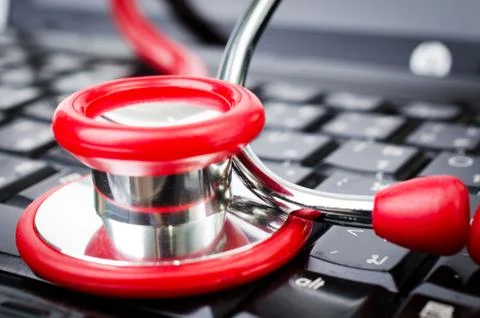 Stethoscope on computer keyboard. Stock Photos