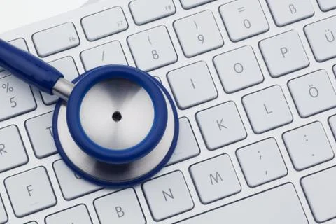 Stethoscope on computer keyboard Stock Photos