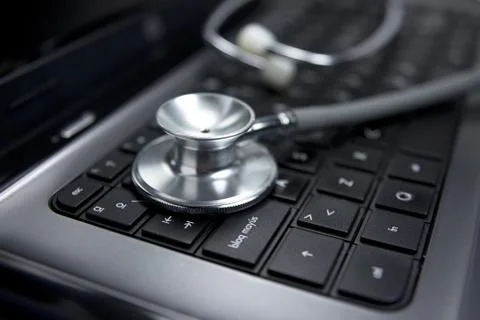 Stethoscope, computer keyboard Stock Photos