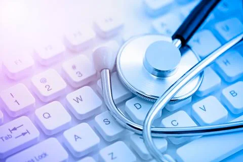 Stethoscope on computer keyboard Stock Photos