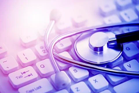 Stethoscope on computer keyboard Stock Photos