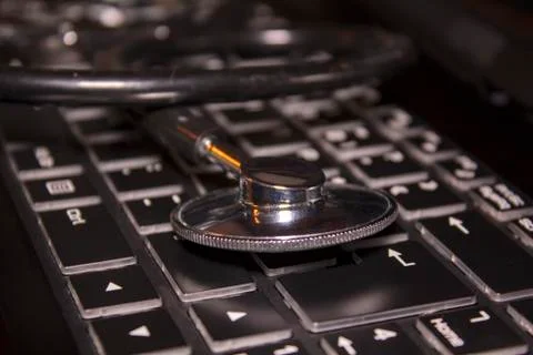 Stethoscope on computer keyboard Stock Photos