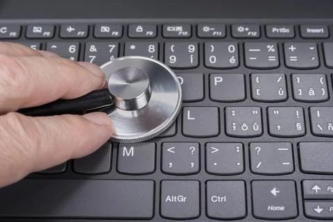 Stethoscope on a computer keyboard Stock Photos