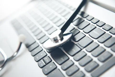 Stethoscope on the computer keyboard Stock Photos