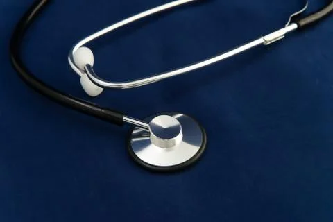 Stethoscope on dark blue background Stock Photos