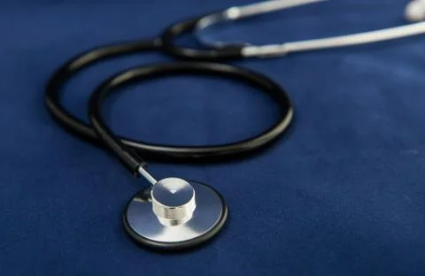 Stethoscope on dark blue background Stock Photos