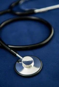 Stethoscope on dark blue background Stock Photos